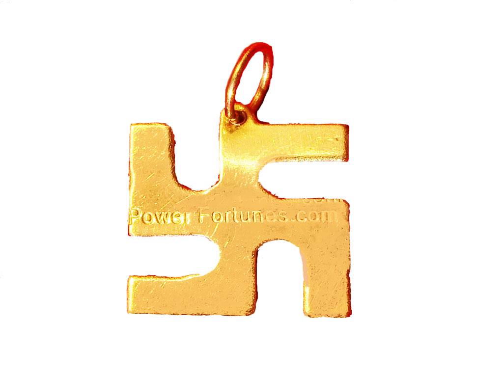A Swastik locket made in brass on a white background