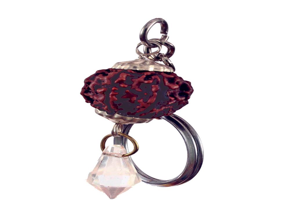 A rudraksh bead attached to a keychain