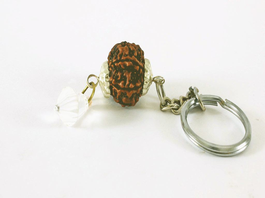A rudraksh bead attached to a keychain